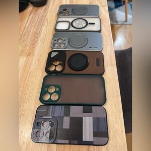 6 Assorted iPhone 15 Pro cases in various designs